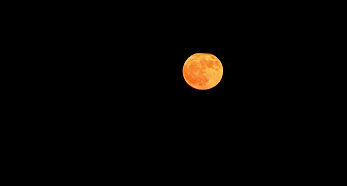 Hunters Full Moon, Full Of Color Tonight In Crystal Beach Tx On Bolivar Peninsula.